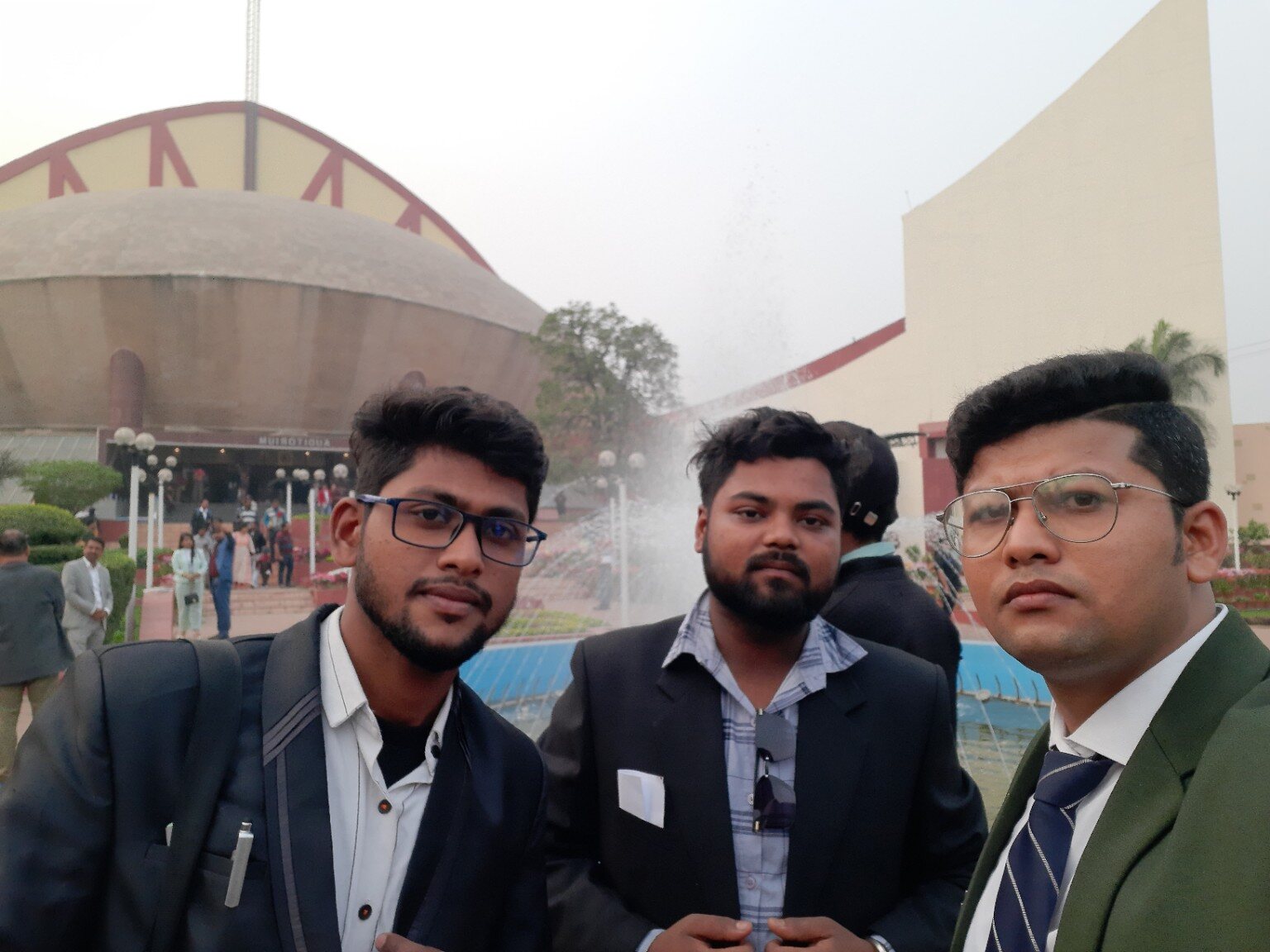 Somnath with peers outside a professional event venue